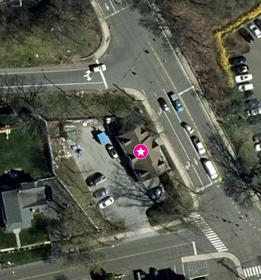 Aerial view showing the building, its lot and the surrounding streets